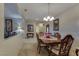 Formal dining area showcasing a wooden table, stylish furnishings, and bright lighting at 3841 Budenny Dr, Las Vegas, NV 89122