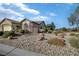 Charming single-story home with a fenced yard with mature shrubbery and desert landscaping at 3841 Budenny Dr, Las Vegas, NV 89122