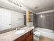 Bathroom with granite vanity, large mirror, and shower-tub combo at 5339 Indian River Dr # 281, Las Vegas, NV 89103