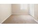 Empty carpeted bedroom with a window and closet space at 5339 Indian River Dr # 281, Las Vegas, NV 89103