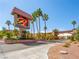 Community entrance showcasing the 'Bella Vita' sign with palm trees and a well maintained landscape at 5339 Indian River Dr # 281, Las Vegas, NV 89103