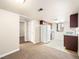Charming kitchen featuring wood cabinets, granite counters, and modern appliances at 5339 Indian River Dr # 281, Las Vegas, NV 89103