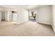 Bright living room featuring plush carpet and sliding doors to a private balcony at 5339 Indian River Dr # 281, Las Vegas, NV 89103