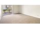 Bright living room featuring plush carpet and sliding doors to a private balcony at 5339 Indian River Dr # 281, Las Vegas, NV 89103