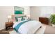 Staged primary bedroom with decorative pillows, side tables, lamps, and dresser at 5339 Indian River Dr # 281, Las Vegas, NV 89103