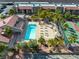 Aerial view of the community pool, lounge area, and adjacent tennis courts at 5339 Indian River Dr # 281, Las Vegas, NV 89103