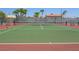 Well-maintained community tennis court with a net, benches, and enclosed fencing at 5339 Indian River Dr # 281, Las Vegas, NV 89103