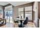 Bright breakfast nook with a round table, four chairs, and natural light from the windows and sliding glass door at 537 Tuscany View St, Las Vegas, NV 89145