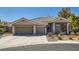 Charming single-Gathering home with a tile roof, three car garage, desert landscaping and a well-manicured lawn at 537 Tuscany View St, Las Vegas, NV 89145