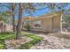 Single story home boasts manicured lawn, desert landscaping, and brick paved walkways to the front entrance at 537 Tuscany View St, Las Vegas, NV 89145