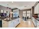 Spacious kitchen with white cabinets, tile floors, and a central island at 537 Tuscany View St, Las Vegas, NV 89145