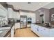 Kitchen features stainless steel appliances, custom cabinets, and sleek countertops at 537 Tuscany View St, Las Vegas, NV 89145
