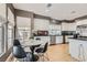 Well-lit kitchen featuring white cabinets, stainless steel appliances, and a cozy breakfast nook at 537 Tuscany View St, Las Vegas, NV 89145