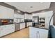 Bright kitchen with white cabinets, stainless appliances, and breakfast bar at 537 Tuscany View St, Las Vegas, NV 89145