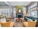 Bright living room features many windows, a fireplace, and stylish furnishings at 537 Tuscany View St, Las Vegas, NV 89145