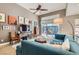 Bright living room with large windows, stylish decor, and seamless access to outdoor living space at 537 Tuscany View St, Las Vegas, NV 89145