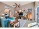 Inviting living room with stylish decor, ceiling fan, and sliding doors providing ample natural light at 537 Tuscany View St, Las Vegas, NV 89145