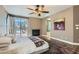 Comfortable main bedroom with fireplace, backyard access, ensuite bathroom, and soft, neutral tones at 537 Tuscany View St, Las Vegas, NV 89145