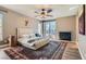 Cozy main bedroom features a fireplace, ceiling fan, area rug, and access to the backyard at 537 Tuscany View St, Las Vegas, NV 89145