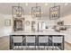 Modern kitchen with a large center island, quartz countertops, stylish pendant lighting, and stainless appliances at 5755 E La Campana Dr, Pahrump, NV 89061