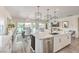 Modern kitchen with stainless steel appliances and access to the dining and living spaces at 5755 E La Campana Dr, Pahrump, NV 89061