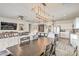 Open-concept living and dining areas with modern furnishings and lighting at 5755 E La Campana Dr, Pahrump, NV 89061