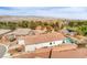 This stunning residence features a tile roof, lush landscaping, and a serene pond nearby at 5755 E La Campana Dr, Pahrump, NV 89061