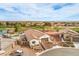 Lovely aerial view of a home with a tile roof, mature landscaping, and a brick driveway at 5755 E La Campana Dr, Pahrump, NV 89061