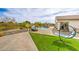 Expansive backyard features a pool, grass, and ample space for entertaining and relaxing outdoors at 5755 E La Campana Dr, Pahrump, NV 89061