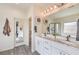 Bright bathroom featuring a double vanity with modern fixtures and a glass-enclosed shower at 5755 E La Campana Dr, Pahrump, NV 89061
