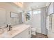 Bright bathroom featuring a tub and shower combination with a large vanity at 5755 E La Campana Dr, Pahrump, NV 89061