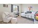 Bedroom featuring a comfy chair, daybed, and a large window at 5755 E La Campana Dr, Pahrump, NV 89061