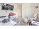 Bedroom featuring a TV mounted on the wall, daybed, and a comfy chair at 5755 E La Campana Dr, Pahrump, NV 89061
