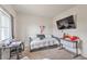 Bedroom featuring a large window, TV, and a daybed at 5755 E La Campana Dr, Pahrump, NV 89061