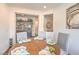 Cozy dining room with a round table set for four, showcasing elegant decor and natural light at 5755 E La Campana Dr, Pahrump, NV 89061