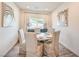 Dining room with seating for six offers natural light and stylish decor at 5755 E La Campana Dr, Pahrump, NV 89061