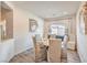 Cozy dining room with seating for six features stylish chairs and a bright window view at 5755 E La Campana Dr, Pahrump, NV 89061