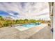 Beautiful backyard pool and patio area with lounge chairs, mountain views, and well-maintained landscaping at 5755 E La Campana Dr, Pahrump, NV 89061
