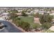 Community park with lush green grass surrounded by desert landscaping and trees at 6032 Port Of Dreams Dr, Las Vegas, NV 89130