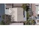 Detailed aerial of a home's roof and landscaping, featuring a well-kept yard and access to a community parking area at 6032 Port Of Dreams Dr, Las Vegas, NV 89130