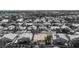 Aerial shot of a single-story home with light-colored roof, set among monochromatic houses and lush trees in a quiet area at 6032 Port Of Dreams Dr, Las Vegas, NV 89130