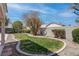 A lush lawn and mature landscaping create a private oasis in this backyard, perfect for relaxation and enjoyment at 6032 Port Of Dreams Dr, Las Vegas, NV 89130