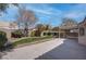 This spacious backyard is complete with mature trees, lush landscaping, and a patio area, perfect for relaxation and entertaining at 6032 Port Of Dreams Dr, Las Vegas, NV 89130