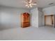 Bedroom featuring tile flooring, neutral walls, and an ornate armoire at 6032 Port Of Dreams Dr, Las Vegas, NV 89130