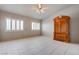 Bedroom featuring tile flooring, neutral walls, shuttered windows and an ornate armoire at 6032 Port Of Dreams Dr, Las Vegas, NV 89130
