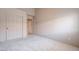 Bedroom with neutral walls, carpet, a closet with sliding doors, and an open door to another room at 6032 Port Of Dreams Dr, Las Vegas, NV 89130