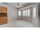 Dining area with built-in cabinets, tiled flooring and shuttered windows at 6032 Port Of Dreams Dr, Las Vegas, NV 89130