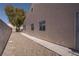 The backyard has a side entrance to the house for convenience at 6032 Port Of Dreams Dr, Las Vegas, NV 89130
