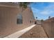 This home features a walkway of pavers along the side of the house at 6032 Port Of Dreams Dr, Las Vegas, NV 89130