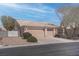 Single-story home featuring a neutral color palette, low maintenance landscaping, and a two-car garage at 6032 Port Of Dreams Dr, Las Vegas, NV 89130